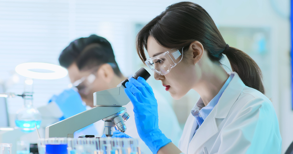 asian scientist team conduct experiment in the laboratory
