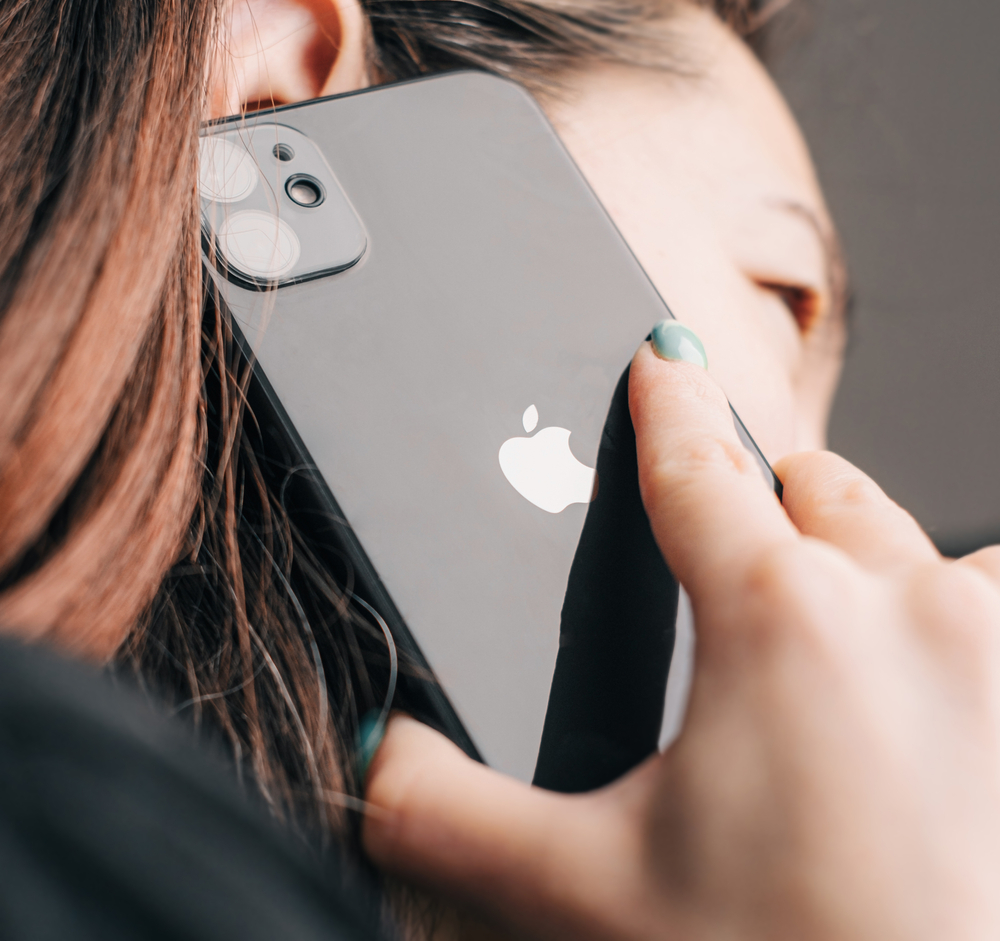 Gelendzhik, Russia, 24 March 2021: The woman calls using the phone Apple iPhone 11 black color.