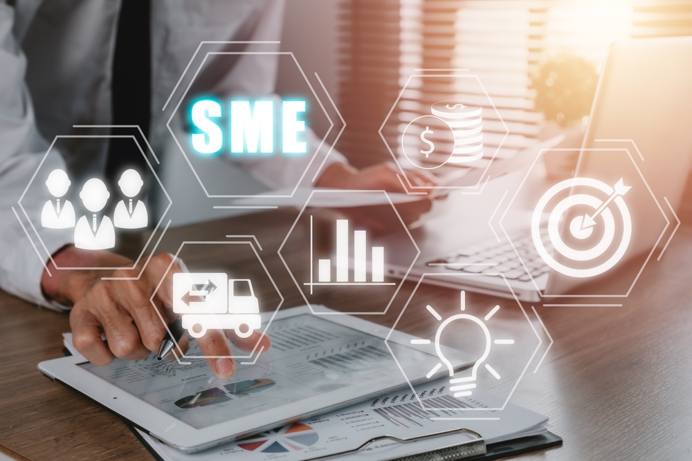SME, Small and medium-sized enterprises, Businessman analyzing income charts and graphs with modern laptop computer, Business model, KEY TO SUCCESS concept.