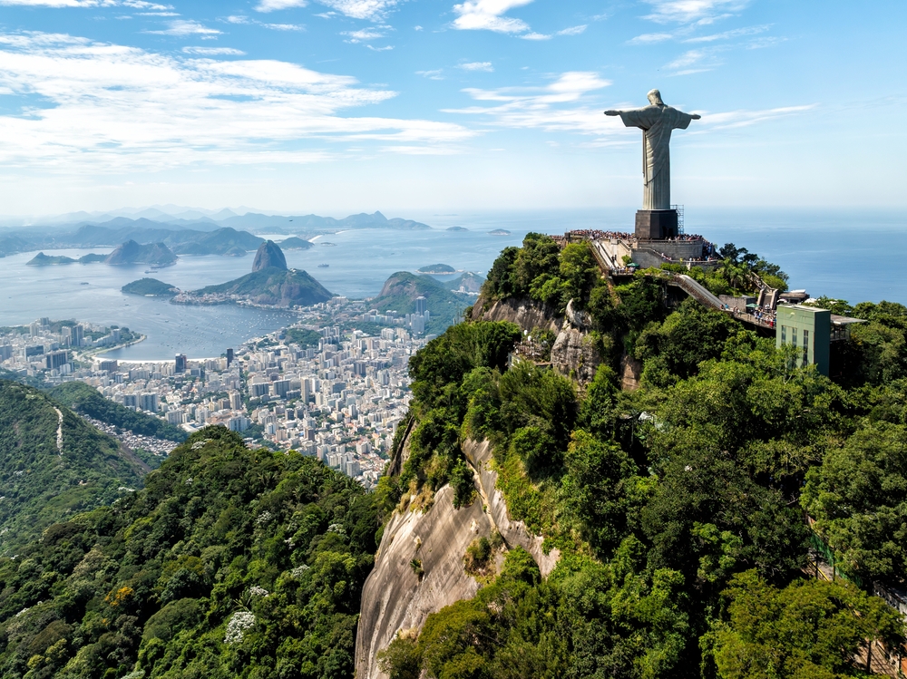 RIO DE JANEIRO, BRAZIL - MARCH 20, 2024: Aerial view of Christ Statue on Corcovado Hill overlooking skyline of Rio de Janeiro, Brazil. One of the world most popular landmark