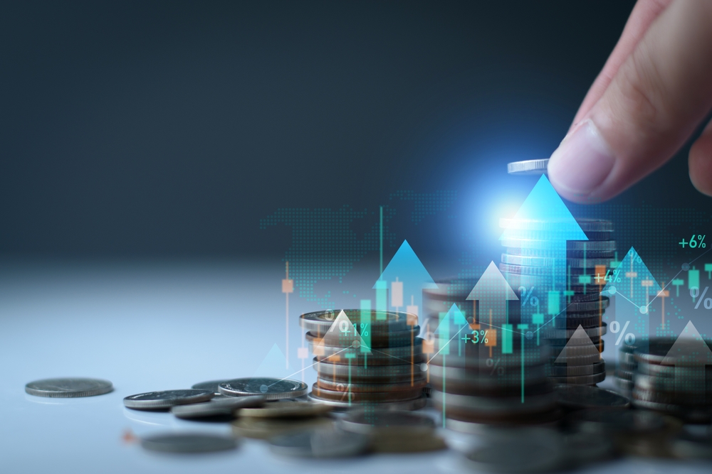 Save money for investment concept. Stack of coins with trading chart in financial, stock market, wealth economy, interest rate, Inflation and tax. Saving money, long term investment