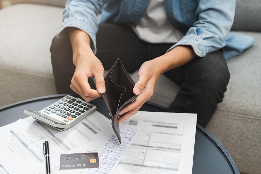 Debt financial concept, stressed problem people asian man, male hand open empty wallet not have budget of money to pay no have credit card, not able payment bill, loan or expense with bank, bankruptcy