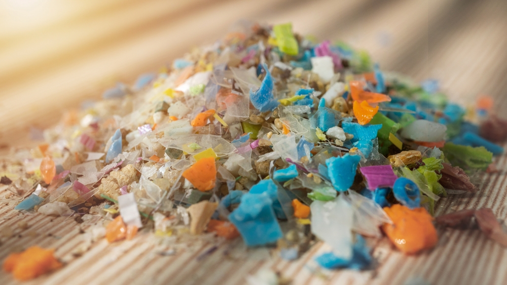 Microplastics collected from the sand on the beach of the Black sea. Concept for microplastic water pollution and global warming.