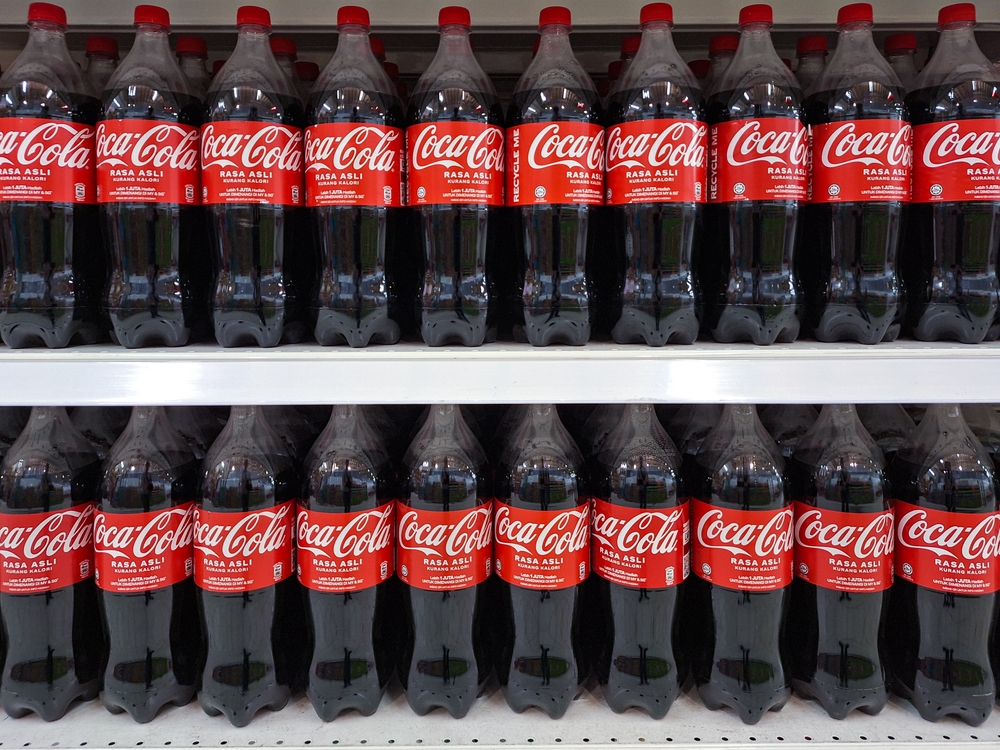 Kuching, Malaysia - 24 October 2024. Coca - cola drinks in large bottle, on display racks at supermarket.