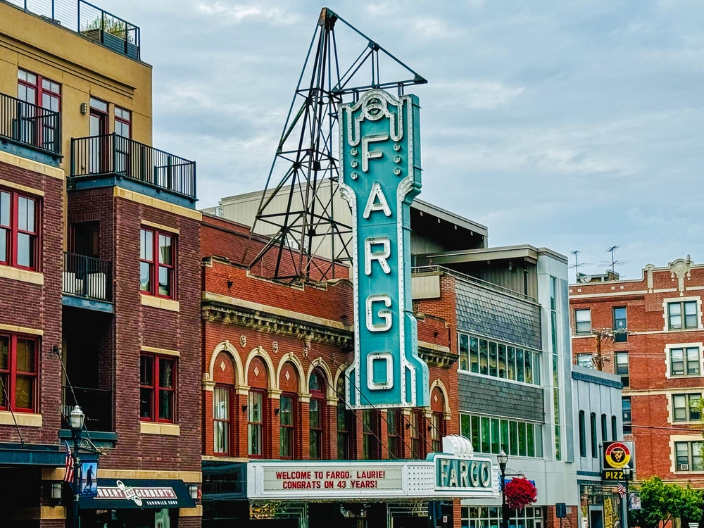 Fargo, ND, USA - August 26, 2024: The vibrant downtown atmosphere is perfectly captured by the iconic "Fargo" marquee, drawing both locals and visitors to enjoy the charm of the area