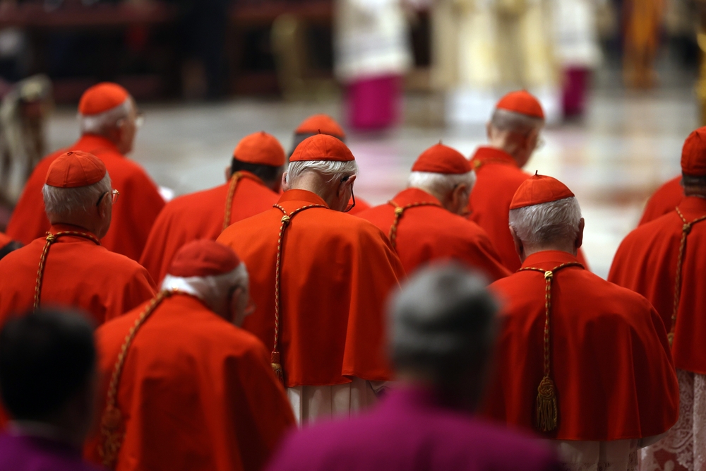 Vatican City, Italy 31.12.2024 : Cardinals sitting listening Pope Francis during the mass of First Vespers and Te Deum in thanksgiving for the past year In Altar of the Confessio, St. Peter’s Basilica