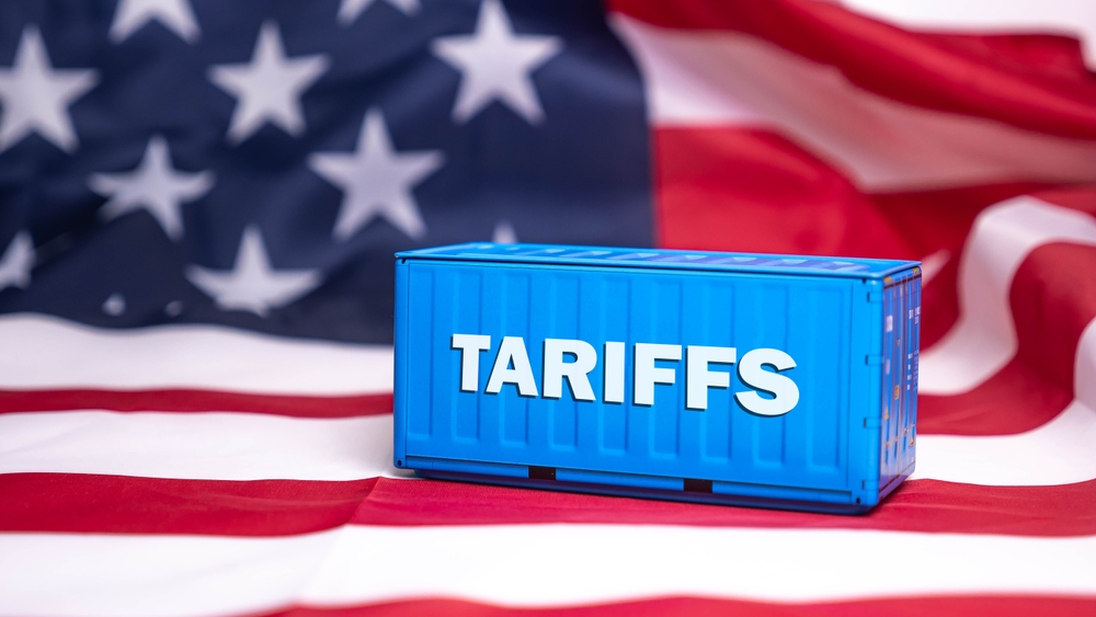 Container tariffs word on Flag of the United States of America background.
Tariff US trade war with Canada and Mexico.