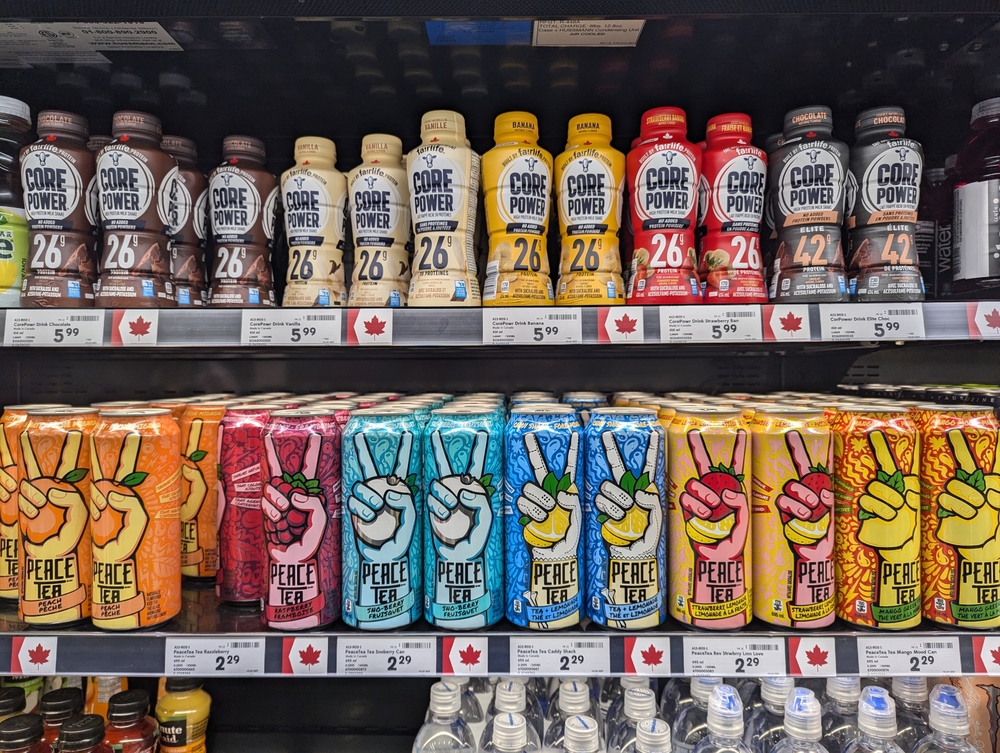 Banff, Canada, March 15 2025. Made in Canada products lining the shelves at grocery store, maple leaf symbol on goods that are Canadian made, assorted shelf food and drink items, amid US trade war