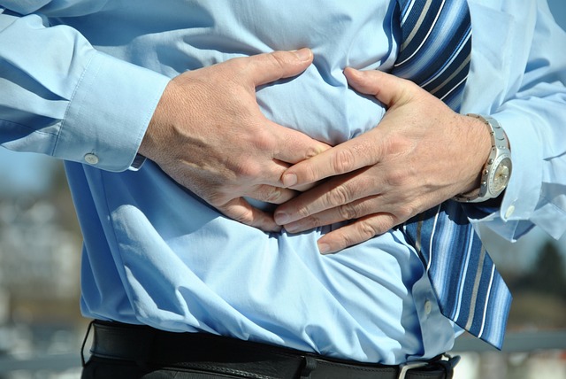 man holding stomach