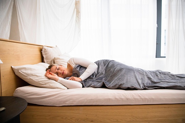 woman lying in bed taking nap