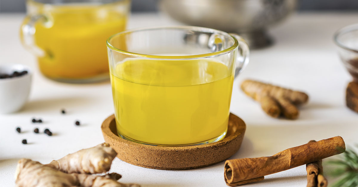 beverage that appears to be turmeric ginger tea, a popular drink known for its potential health benefits.