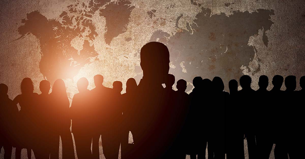 black silhouettes of business people, wold map in background