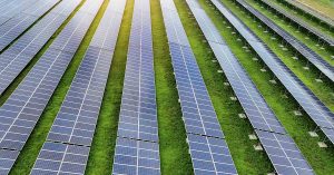 Grazing Sheep Beneath Solar Panels Show Surprising Changes That May Transform Farming rows of solar panels in a field. Solar farm