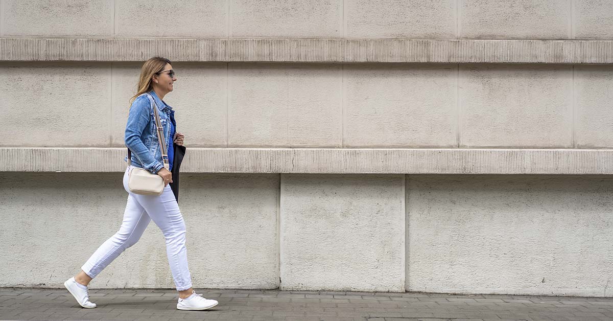 woman walking down side walk