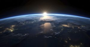 Sun rising over earth's horizon, seen from orbit
