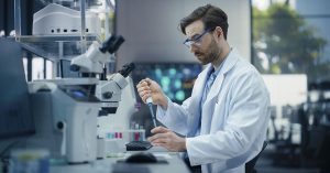 cientist in a modern laboratory, examining something in a research setting