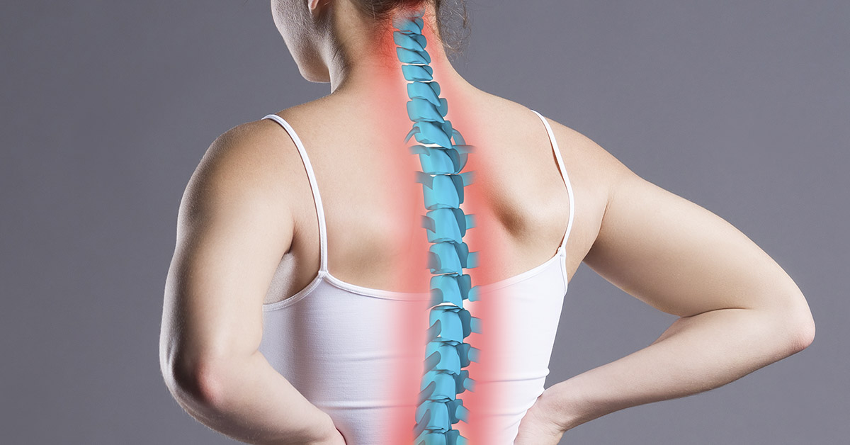 woman holding spine. Back and spinal health concept