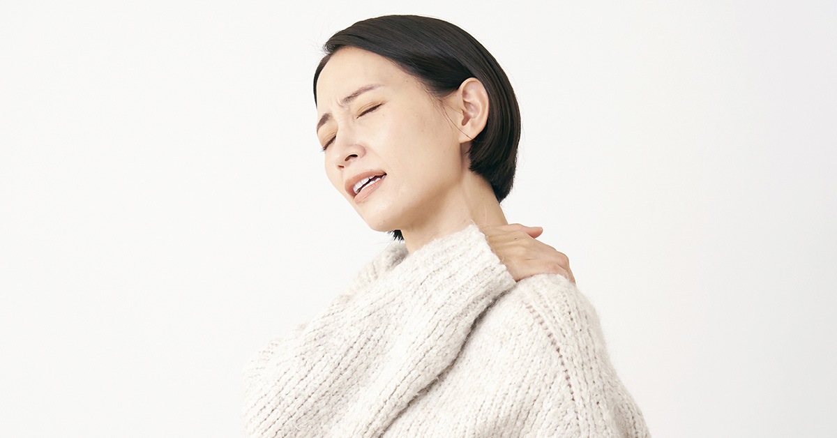 woman holding her shoulder in pain. Frozen Shoulder pain concept