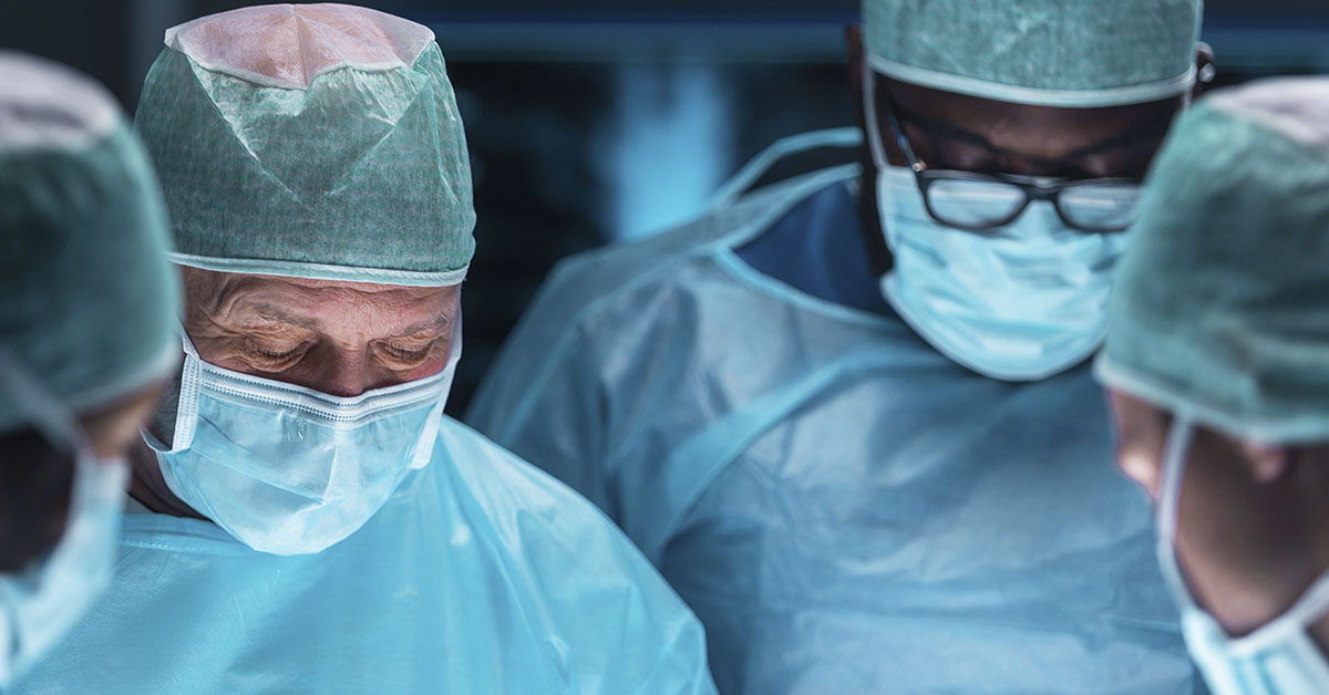surgeons working on patient