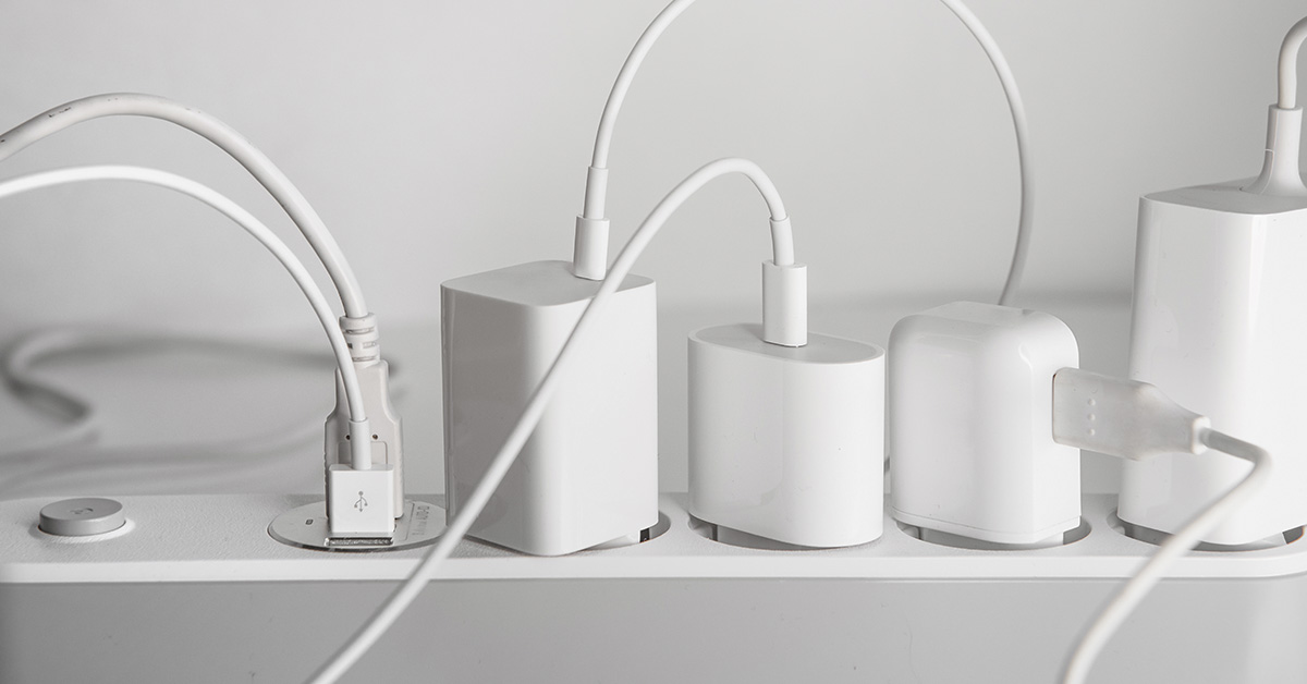 various chargers left plugged in to power bar strip