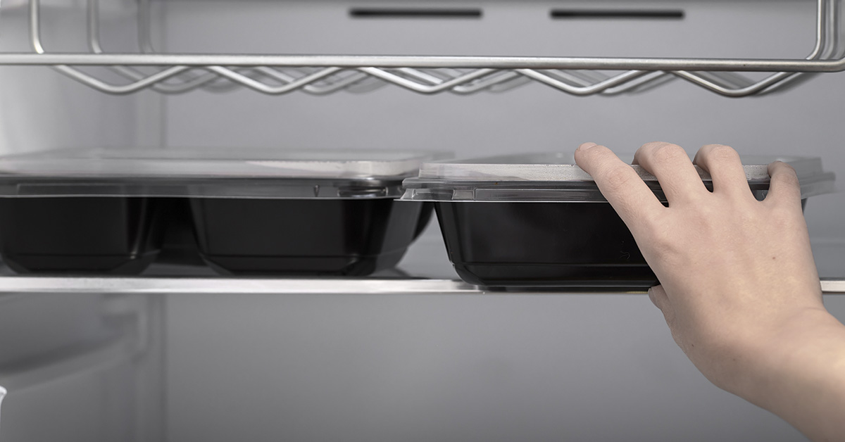 Put a plastic container with dinner in the fridge to reheat the next day, catering