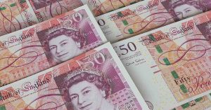 UK Households Urged to Stockpile Physical Cash Amid Economic Uncertainty UK currency. 50£ notes