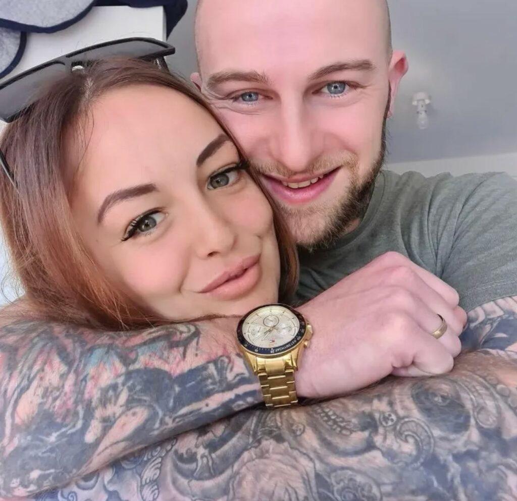 Beth Martin with husband in loving embrace