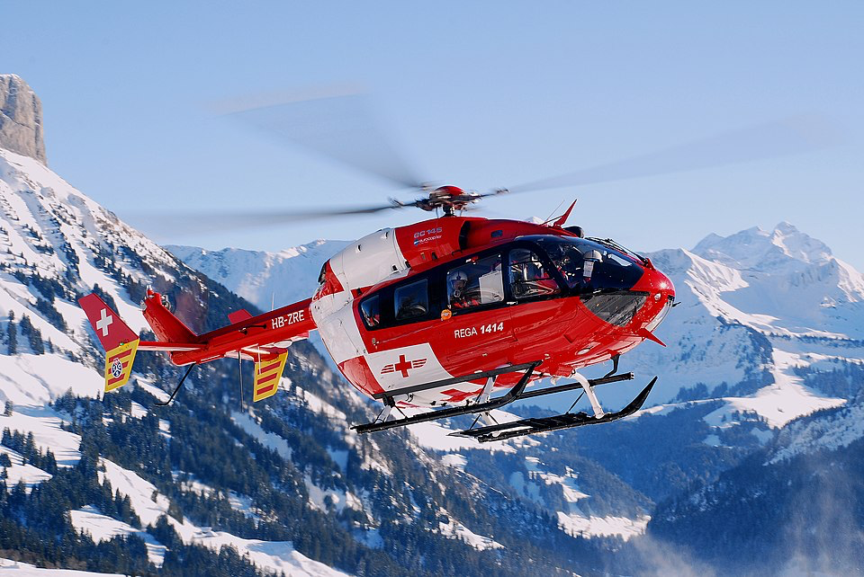 Rescue helicopter flies over snowy peaks during the evacuation that airlifted livestock to safety before the disaster.