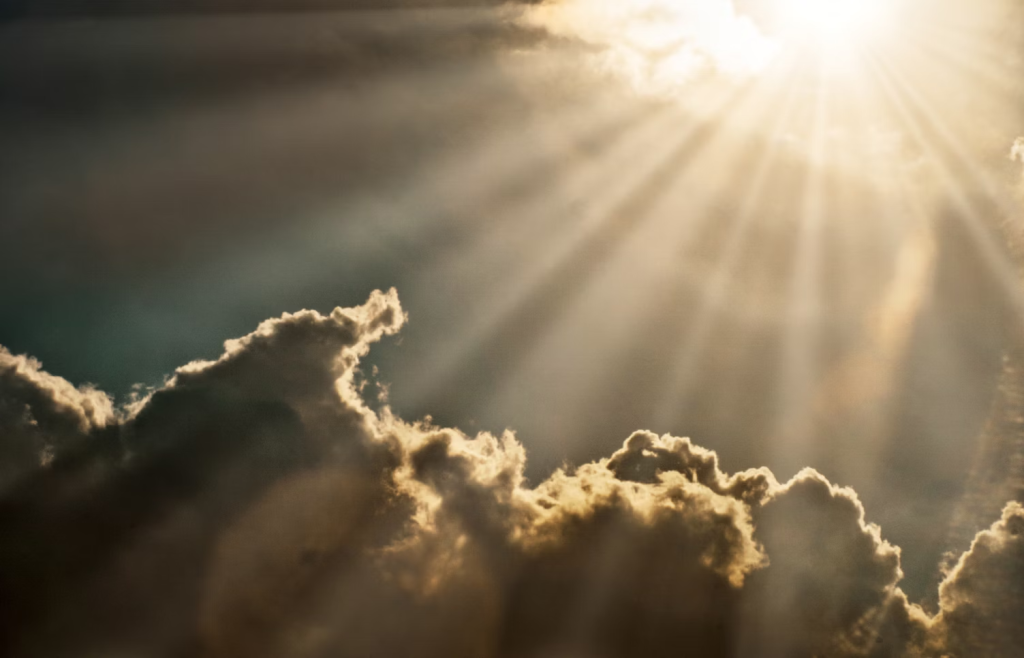 sun shinning through the clouds. Sunlight can be an uncommon cause of hives
