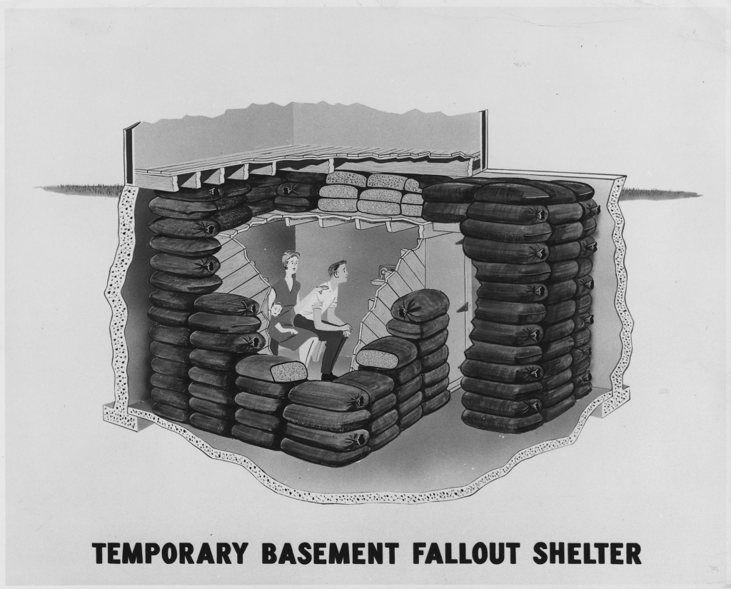 Cross-section illustration showing family sheltering in basement bunker with sandbag walls.