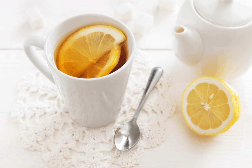 The golden drink sits perfectly in a white mug, complete with its signature lemon slice on top.