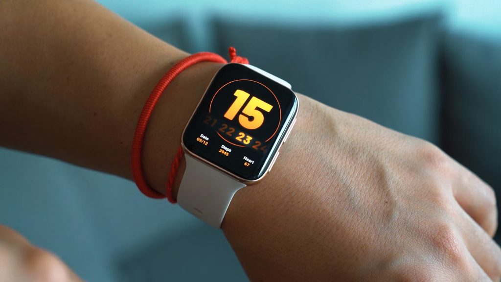 Person wearing a smartwatch displaying the number 15 on the screen with fitness metrics.