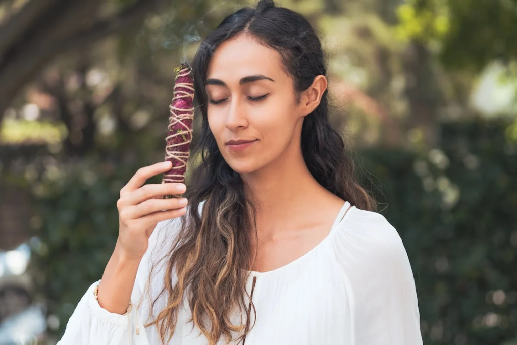 Woman Holding Burning Herbs