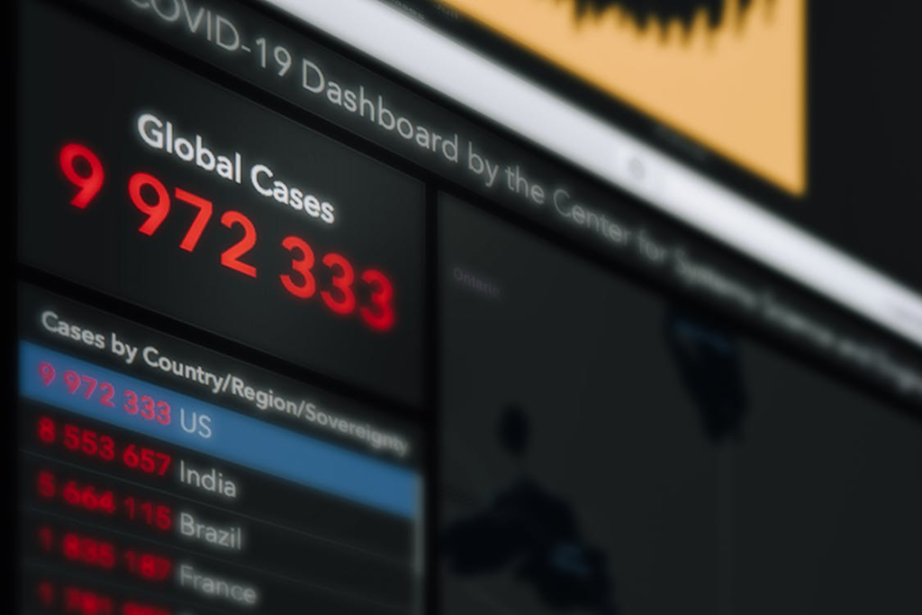 Monitor with inscriptions and numbers about COVID 19 pandemic