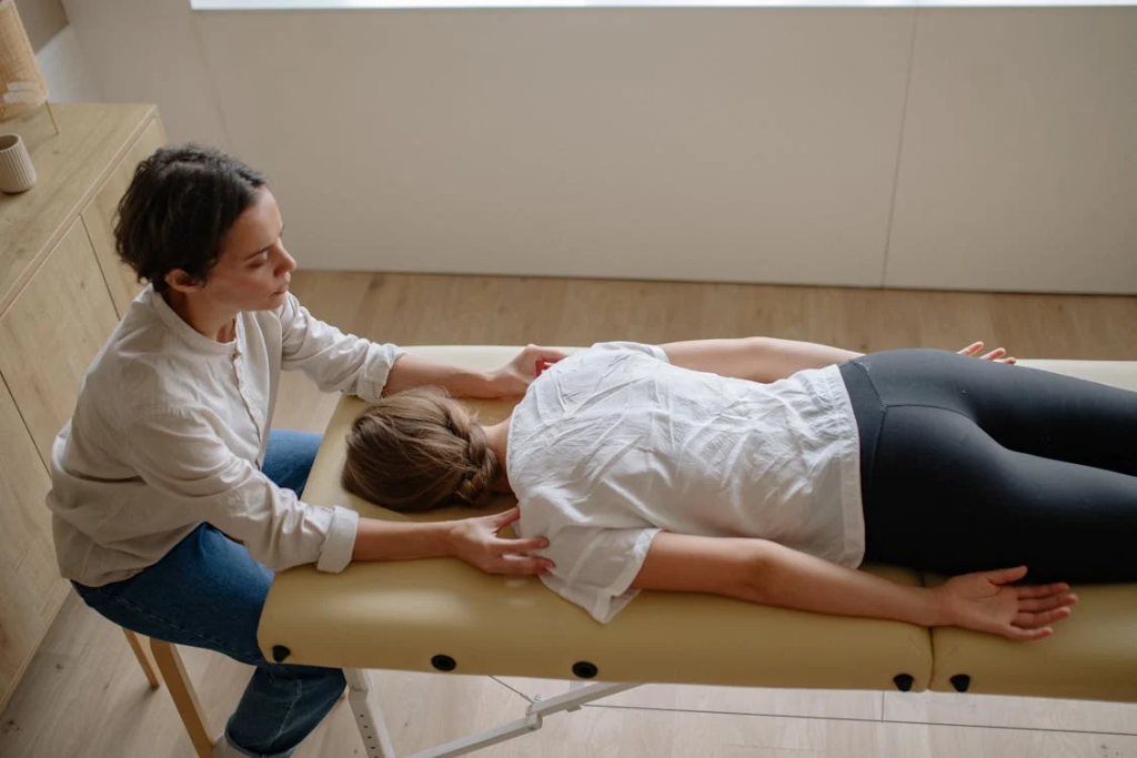 A Woman in White Shirt Lying Face Down on the Bed