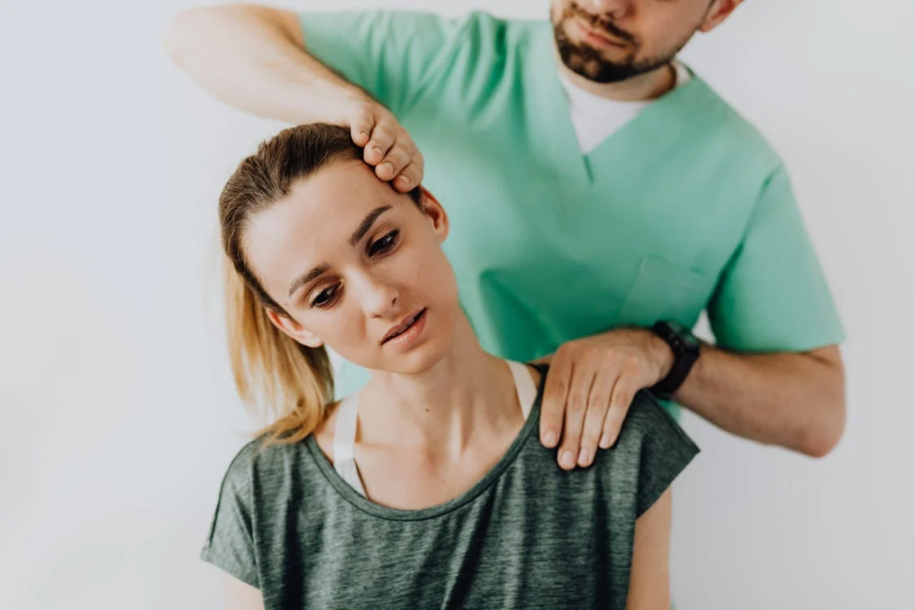 Professional Massage Therapist Treating a Female Patient's Injured Neck