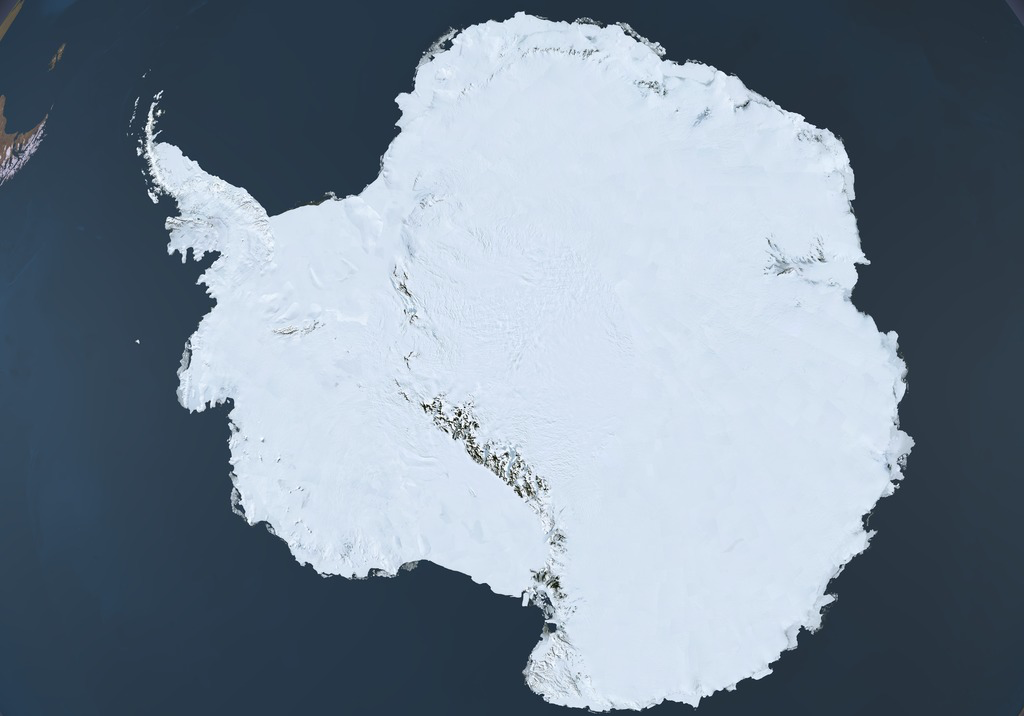 Satellite view of Antarctica showing the massive white ice sheet surrounded by dark ocean waters.