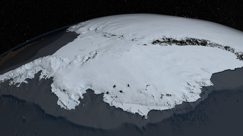 Satellite image of Antarctica's ice sheet from space showing the curved white continent against the black backdrop of space.