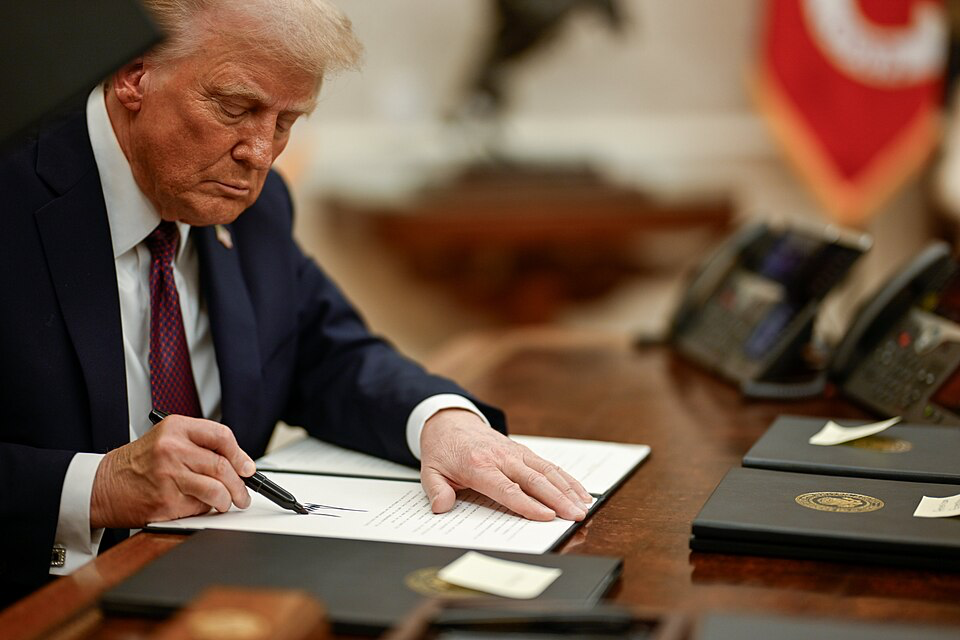 Trump signing the executive order banning transgender athletes from women's sports.
