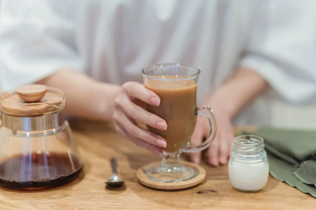 Hand on Glass of Coffee