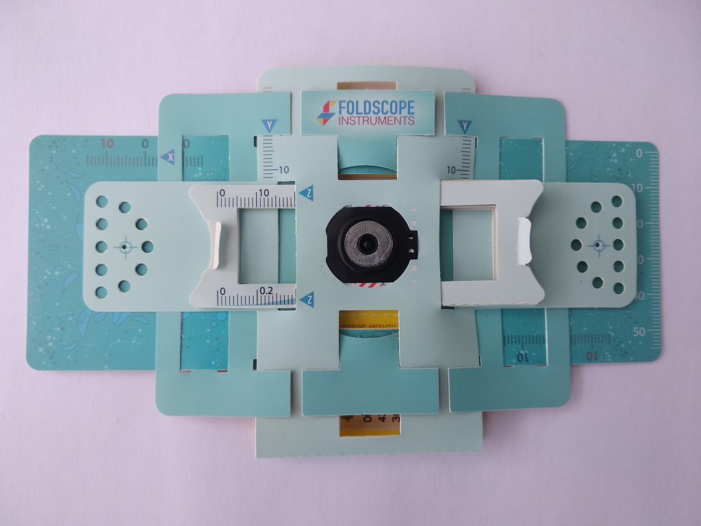 Complete version of an esembled Foldscope which was used to discover smiling grass.