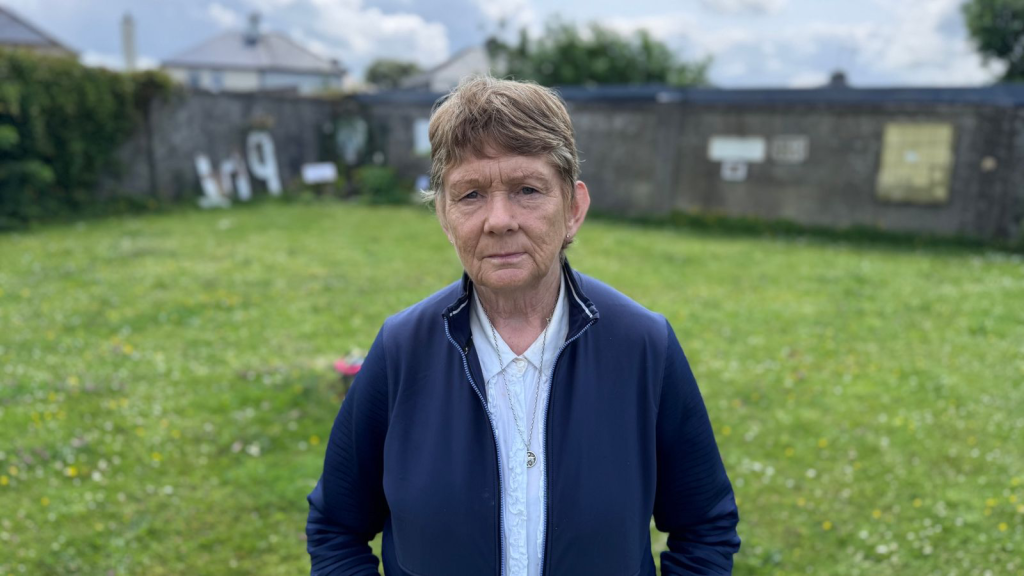 Catherine Corless, a retired teacher turned local historian, standing by the mass grave site.