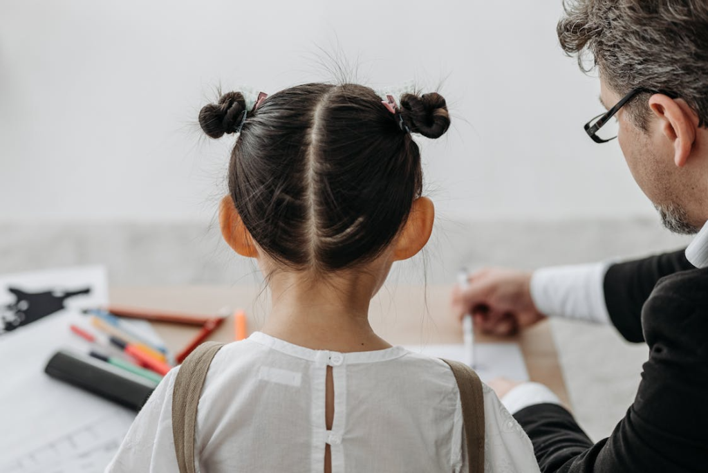Back View of a Girl Sitting beside a Man