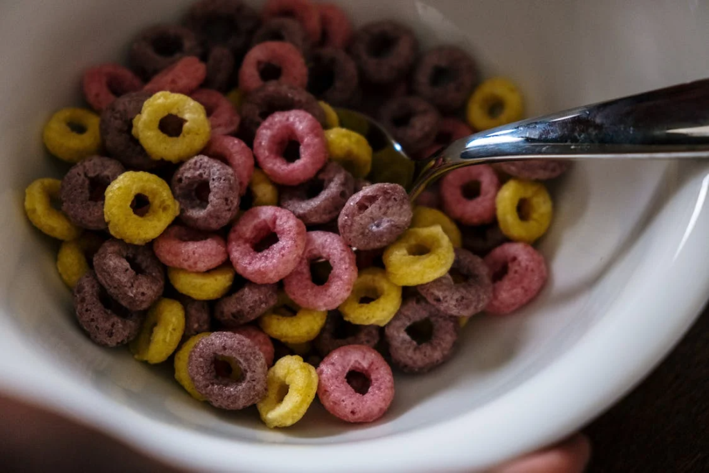 Close-Up Shot of Brown and Pink Round Cereals