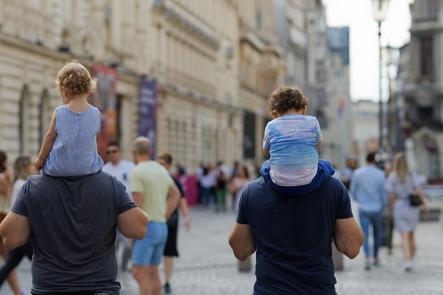 dads with children on their shoulders