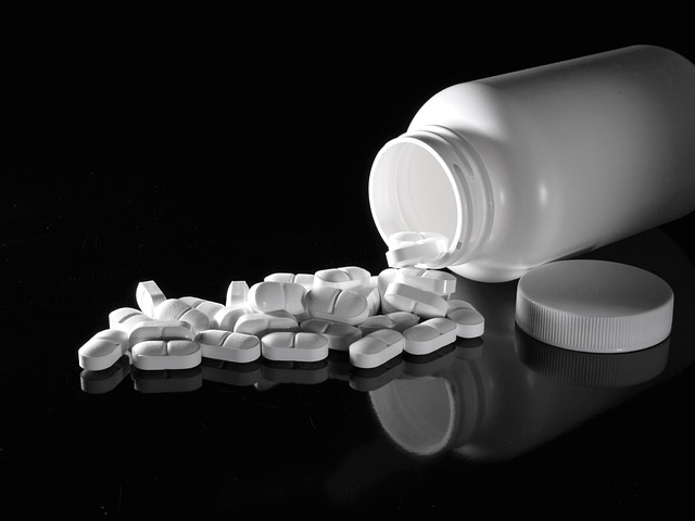 pills spilling out of a bottle