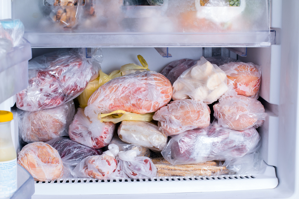 Refrigerator with frozen food (meat, milk, vegetables). Ready meal