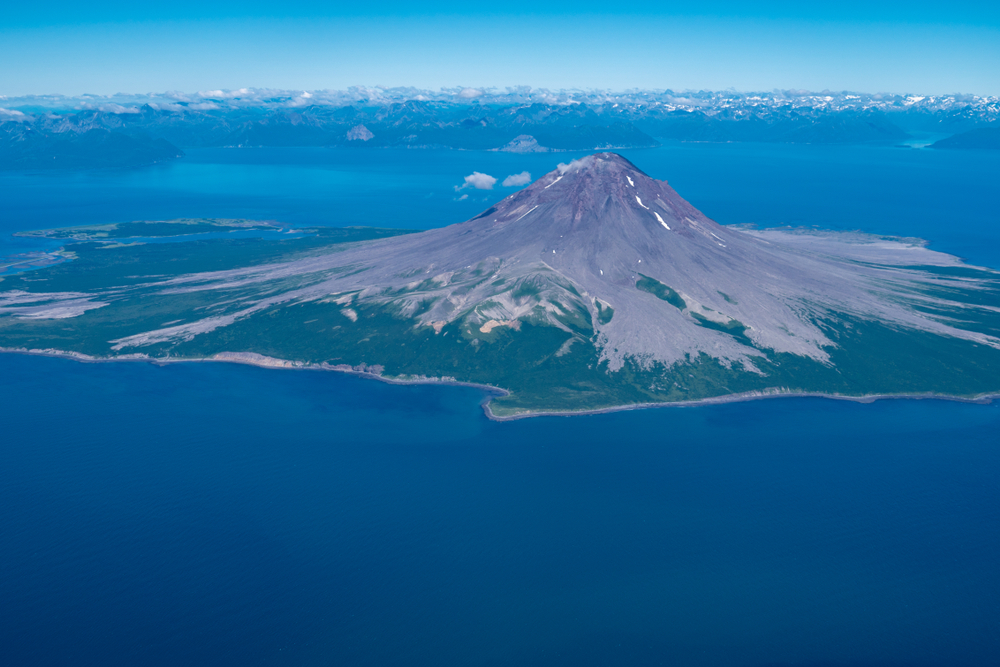 Aerial photography view of Augustine Volcano in Alaska's Cook Inlet on a sunny day