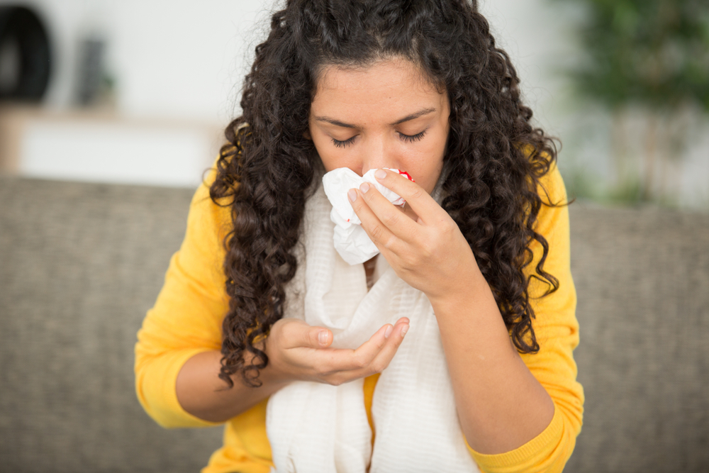 woman with nosebleed