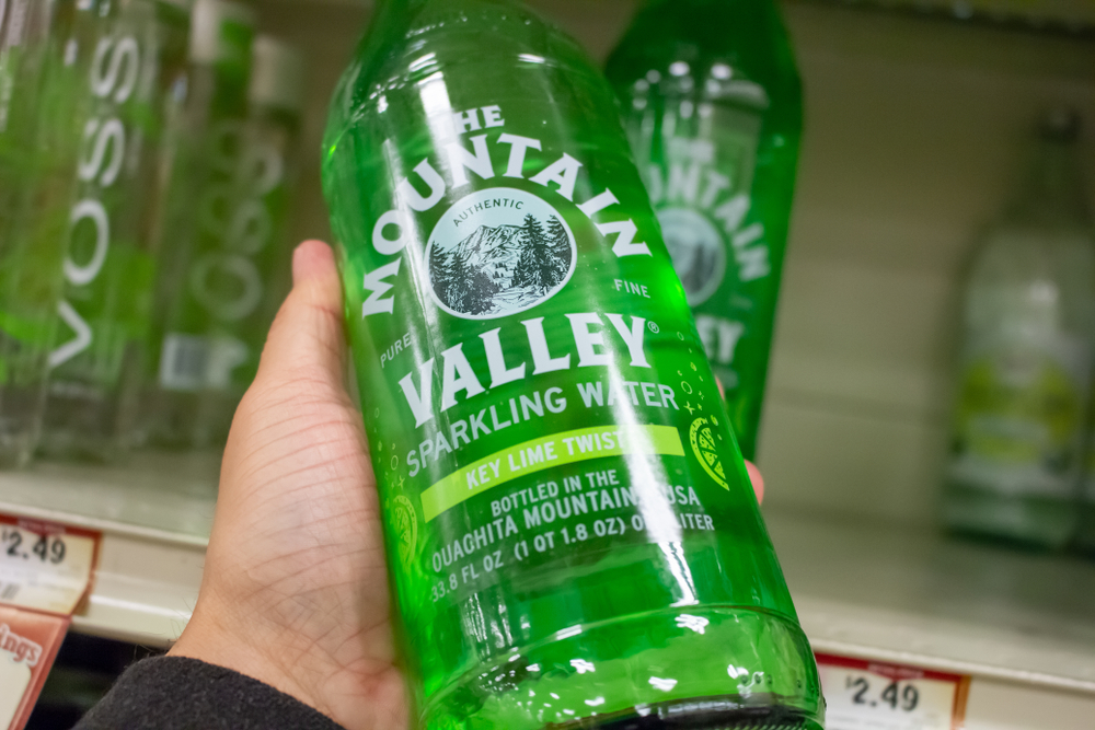 Los Angeles, California, United States - 04-05-2019: A view of a hand holding a bottle of Mountain Valley Spring water at the grocery store.